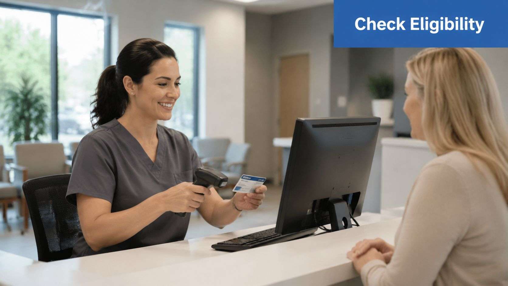 A smiling medical receptionist scanning a patient insurance card at a modern clinic front desk.