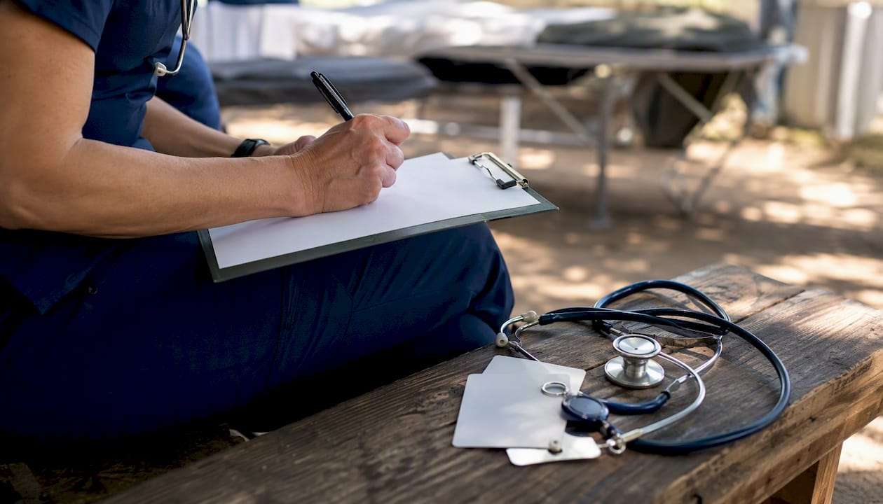 Charge nurse marking checklist during chart audit