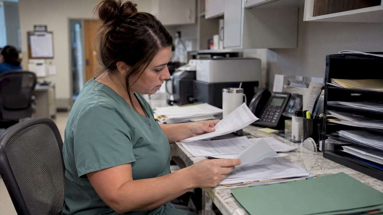 Billing specialist reviewing an urgent care denial